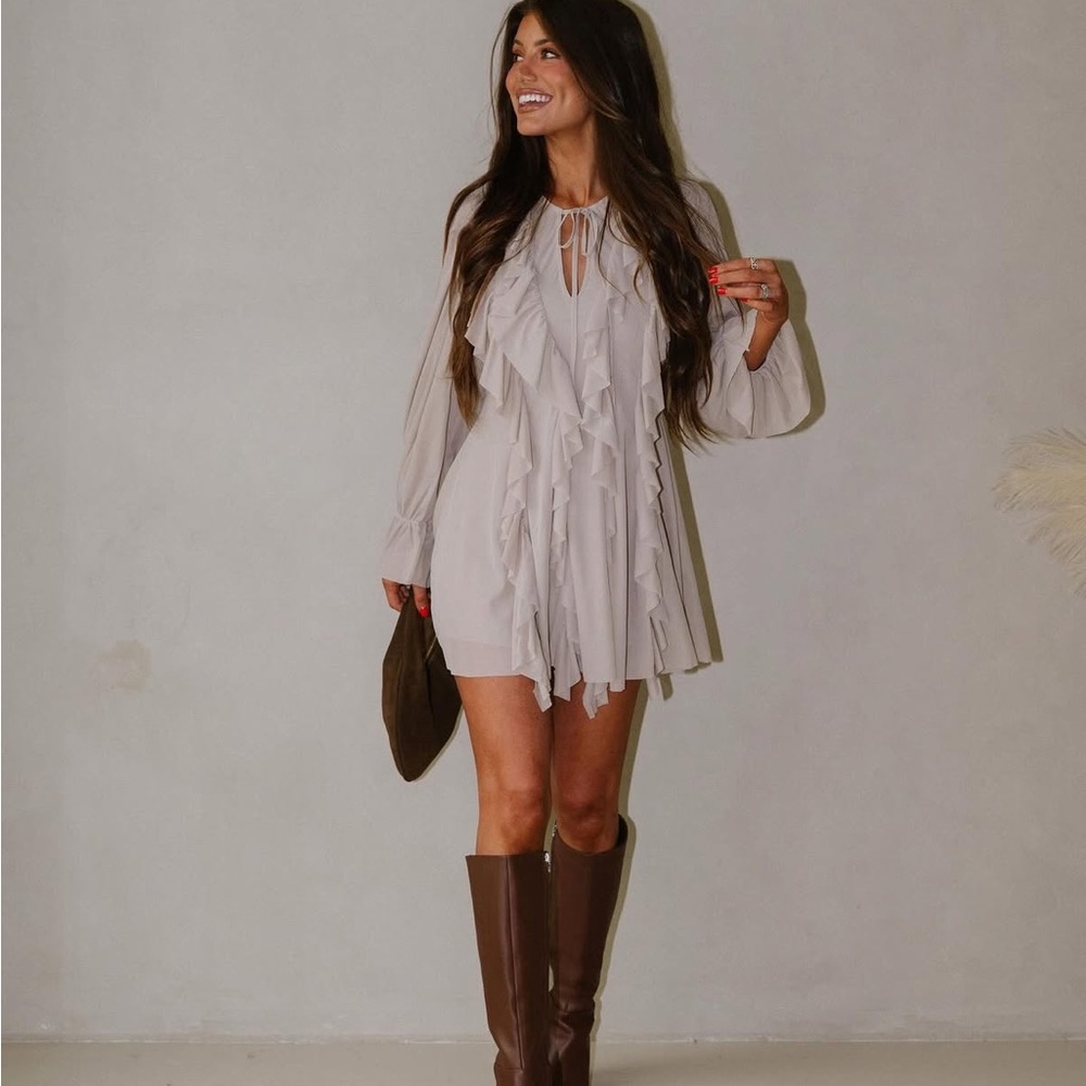 These theee boutique stone ruffle romper